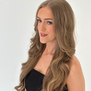 Woman with long, wavy hair on a white background